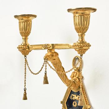 A pair of two-branch late Louis XVI ormolu and blued steel appliques attr. to F. Rémond (bronzier in Paris 1774-1812).