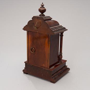 An early 20th century German Junghans table clock with music box.