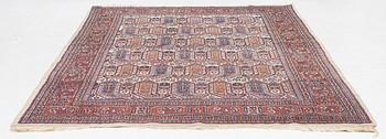 An oriental carpet, approx. 286 x 200 cm.