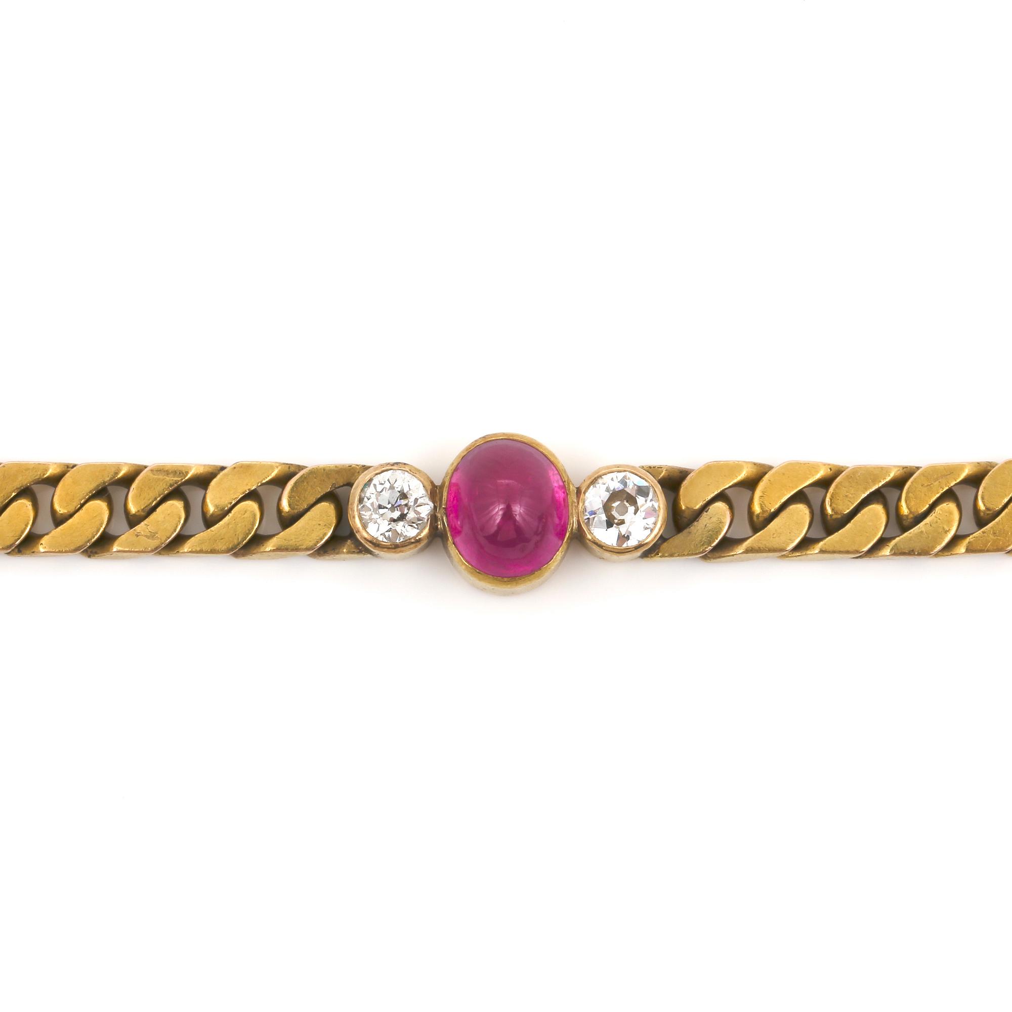 ARMBAND, 14K guld med cabochonslipad rubin, ca 1.95ct och 2 gammaslipade diamanter tot ca 0.50 ct. Vikt ca 19 g,