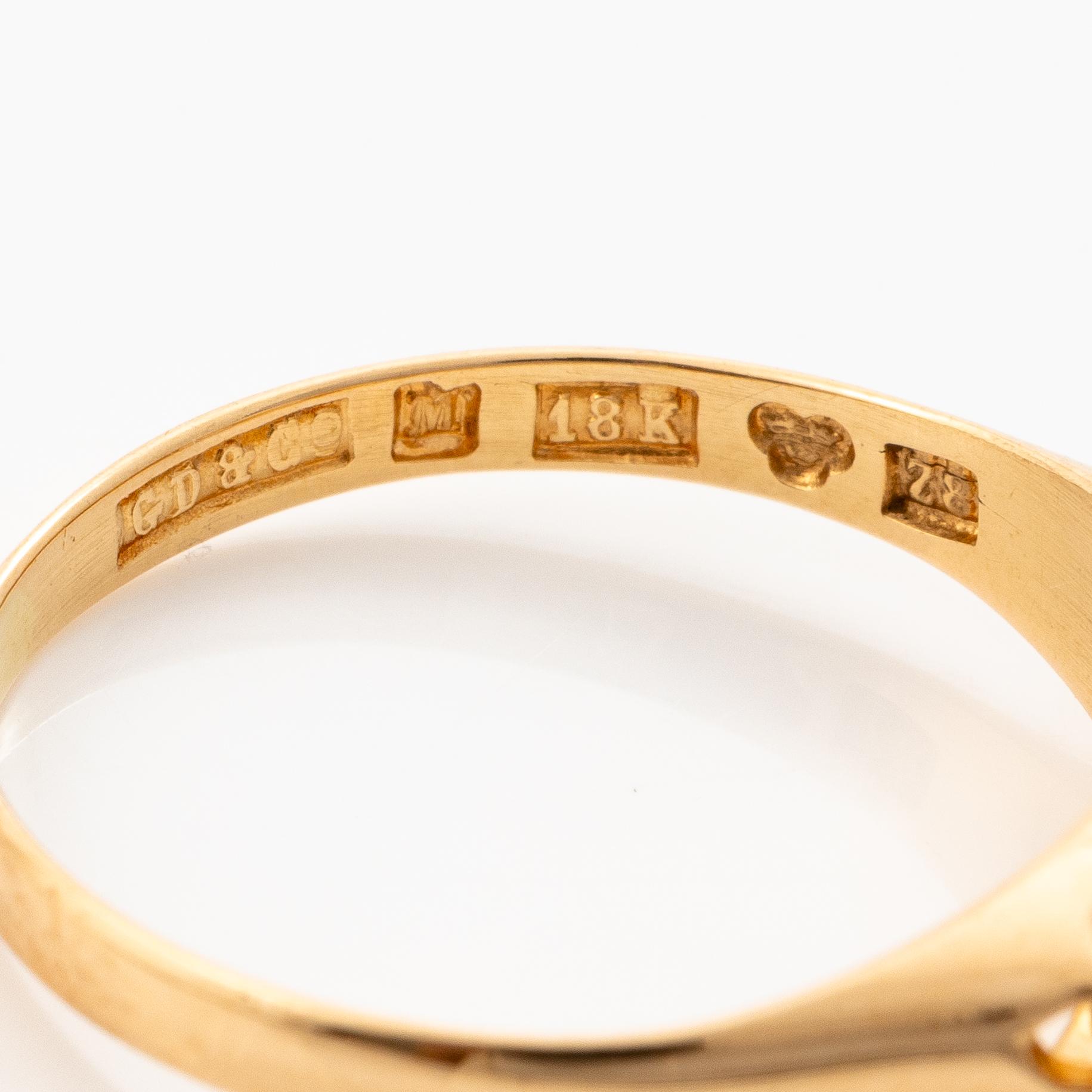 18K gold ring with three brilliant-cut diamonds.