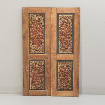 A pair of South East Asian carved wooden doors, presumably Java, 19th Century.