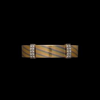 ELIS KAUPPI, BRACELET. 18K three-colour gold, total amount of diamonds 1.00 ct. Kupittaan Kulta 1989.