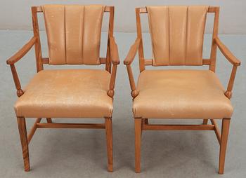 A pair of Josef Frank walnut and light brown leather armchairs, Svenskt Tenn.