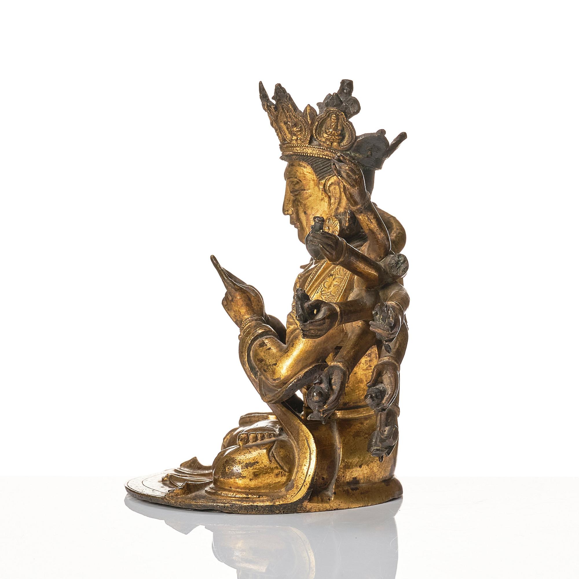 A gilt-bronze figure of a Boddhisattva, Ming dynasty (1638-1644).
