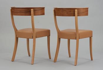 A pair of Josef Frank walnut, beech and brown leather chairs, Svenskt Tenn, model 300.