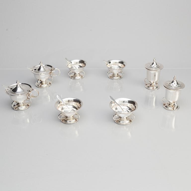 Josiah Williams & Co, an eight piece silver cruet set, London 1904.