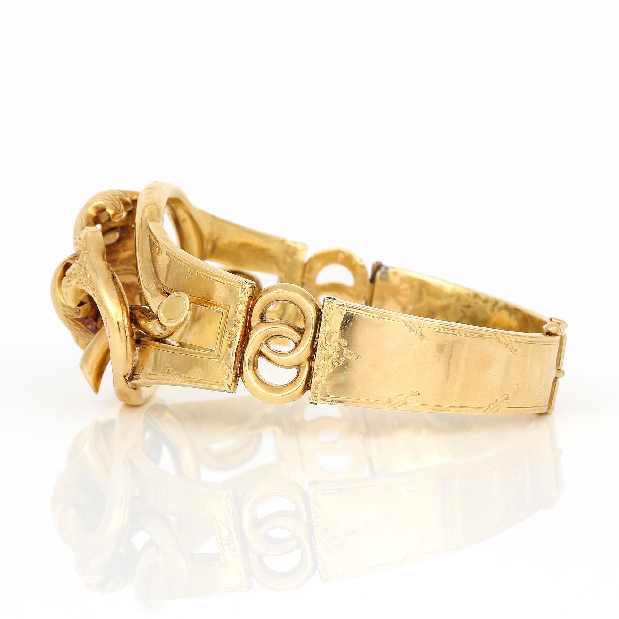 ARMRING, 18K guld, Norrköping, 1886. Total vikt ca 23 g.