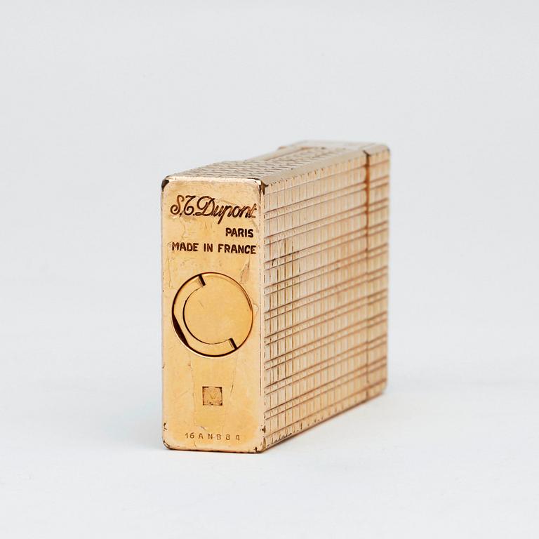 S T DUPONT, a gilded metal ligther.