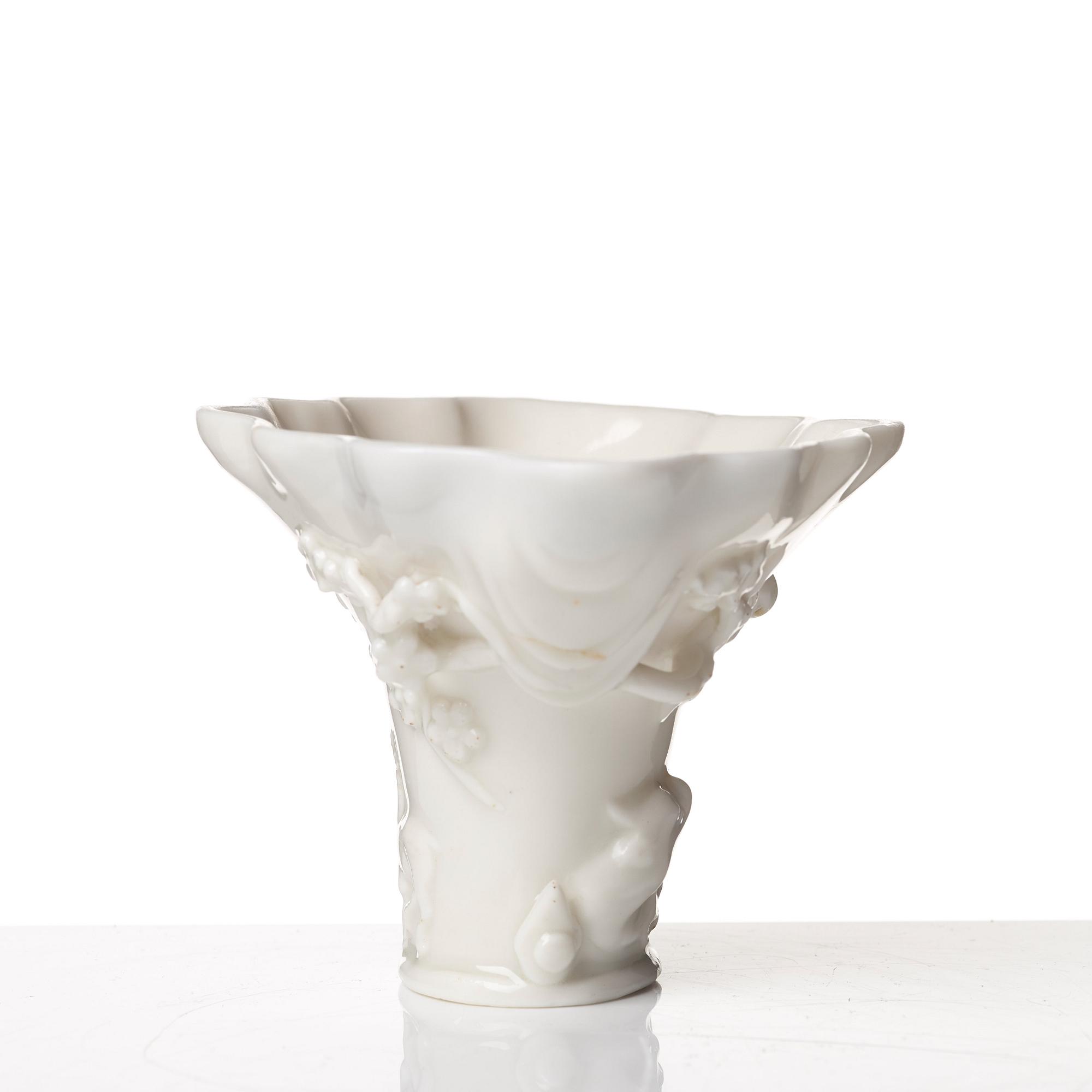 A blanc de chine rhinoserous libation cup, Qing dynasty, Kangxi (1662-1722).