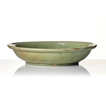 A large carved longquan celadon 'lotus' dish, Song/Ming dynasty.