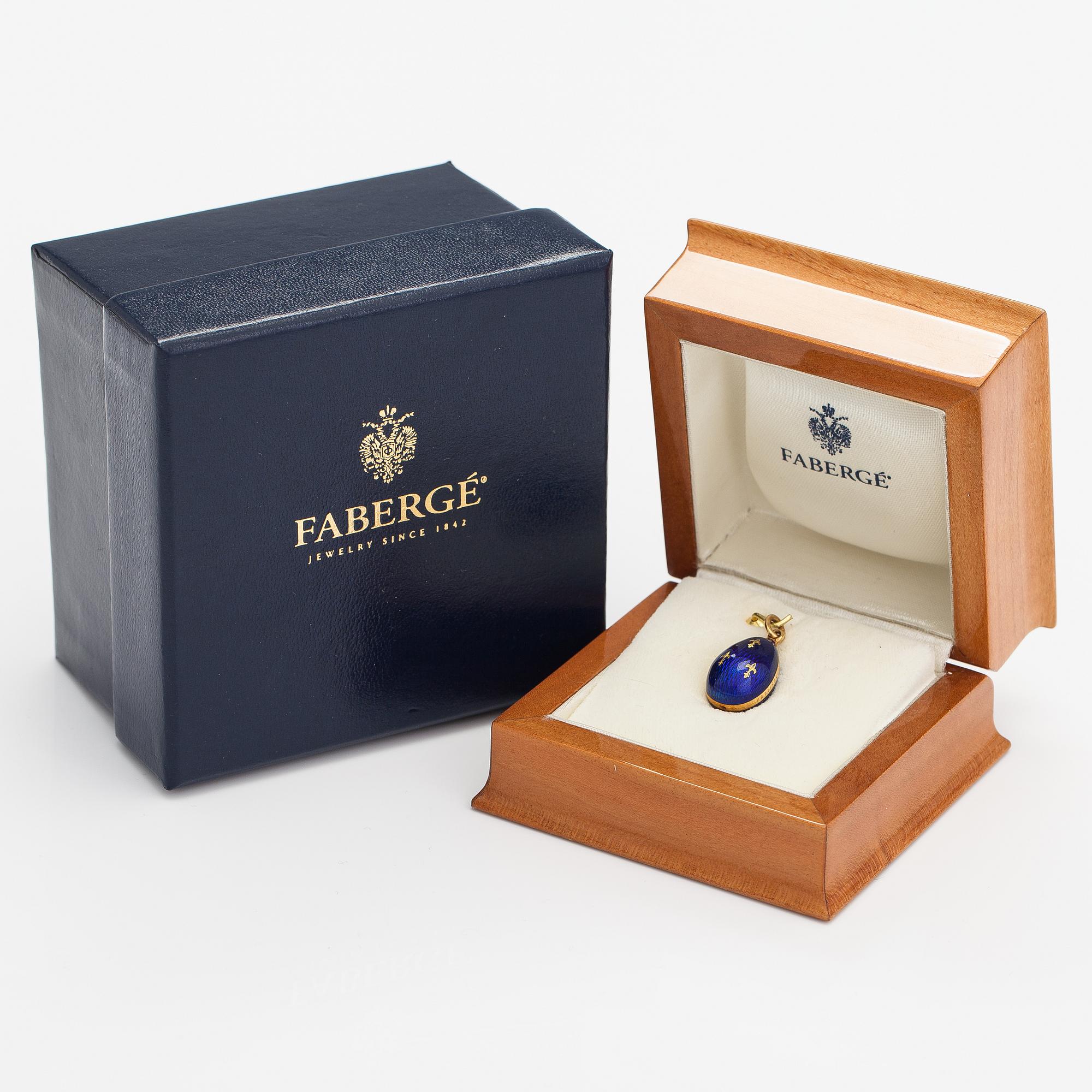 Fabergé, An 18K gold and enamel egg shaped pendant. Marked Fabergé, 573/1000. Victor Mayer.