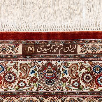 A silk Qum, Central Persia, signed Jashmedi c. 141 x 103 cm.