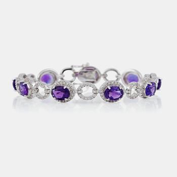 A circa 10.50 ct amethyst and brilliant-cut diamond bracelet. Total carat weight of diamonds circa 2.07 cts.