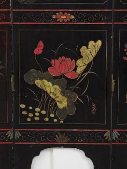 A Chinese four panel lacquer folding screen, first part of the 20th century.
