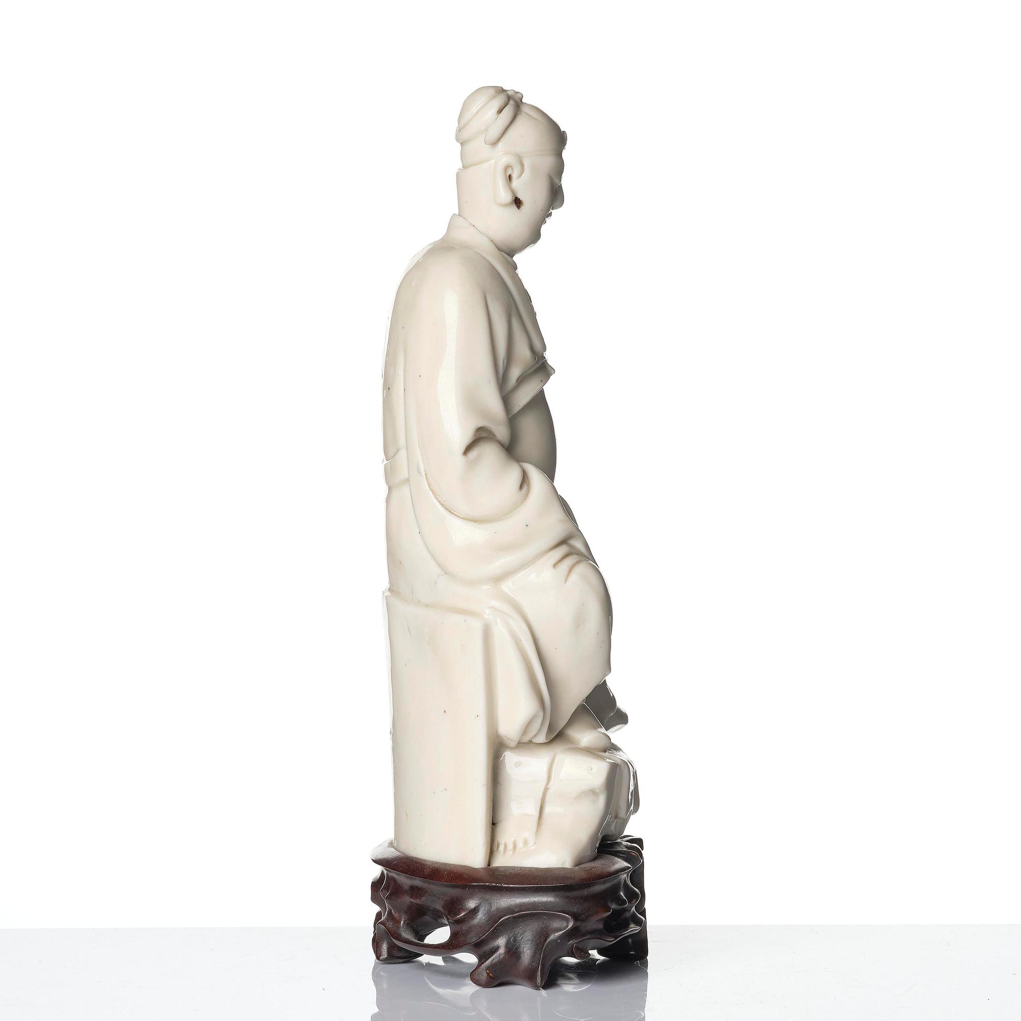 A blanc de chine figure of Guandi, Qing dynasty, 18th century.