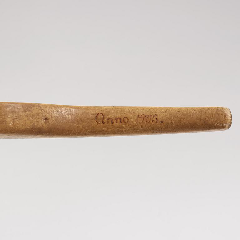 a swedish wooden ladle dated 1903.