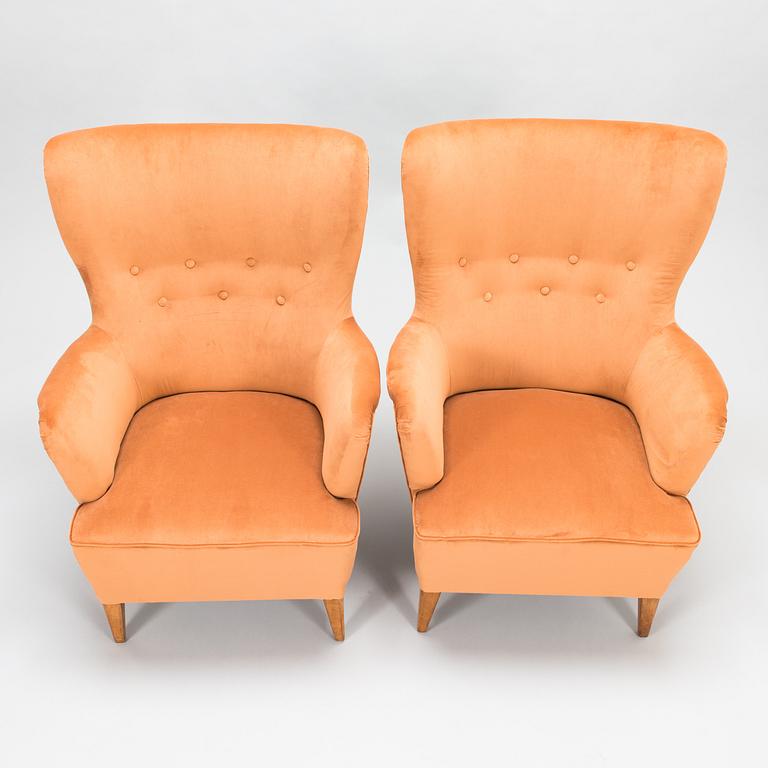 A pair of 1950's open arm chairs for Oy Paul Boman Ab.