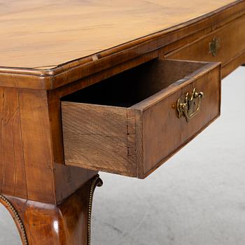 A George II walnut partner's desk, mid 18th century.