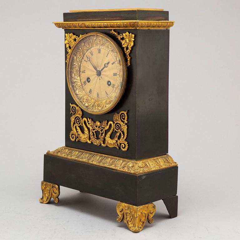 An Empire-style late 19th century mantel clock.