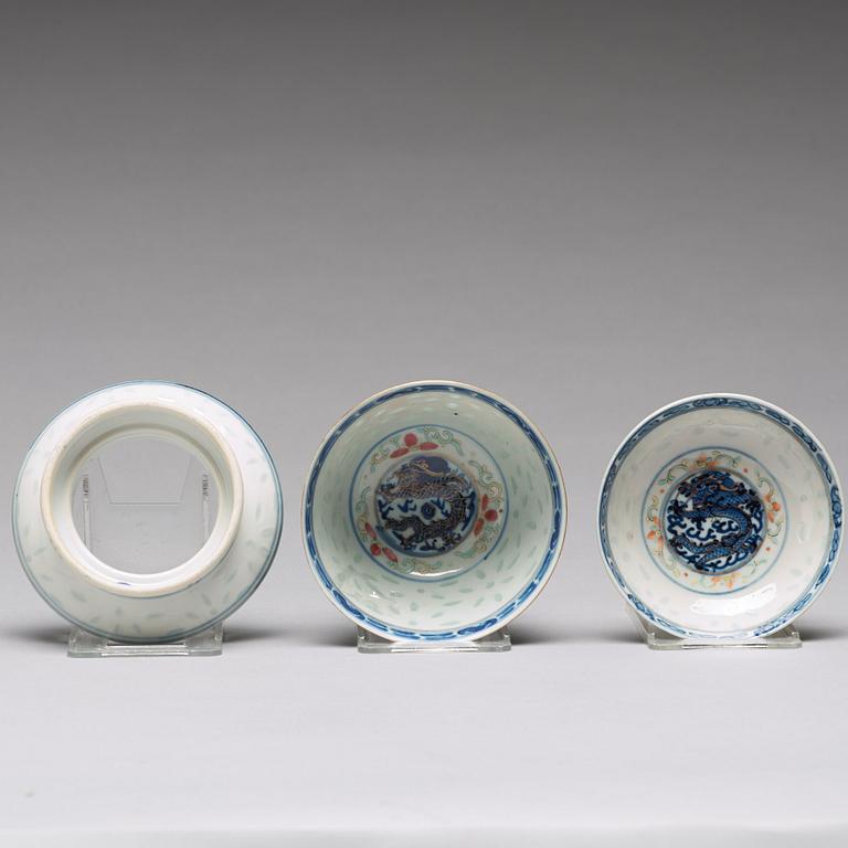 A sang de boef vase and bowl and an enamelled cup with cover and stand, Qing dynasty (1664-1912).