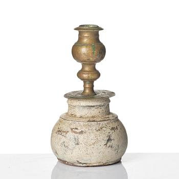 A Northern European baroque candlesticks, late 17th century, with a repaired wooden base.