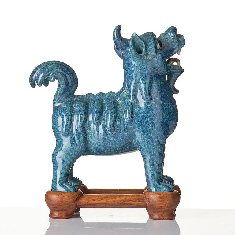 A turquoise/robins egg glazed figure of a buddhist lion, Qing dynasty, Jiaqing (1796-1820).