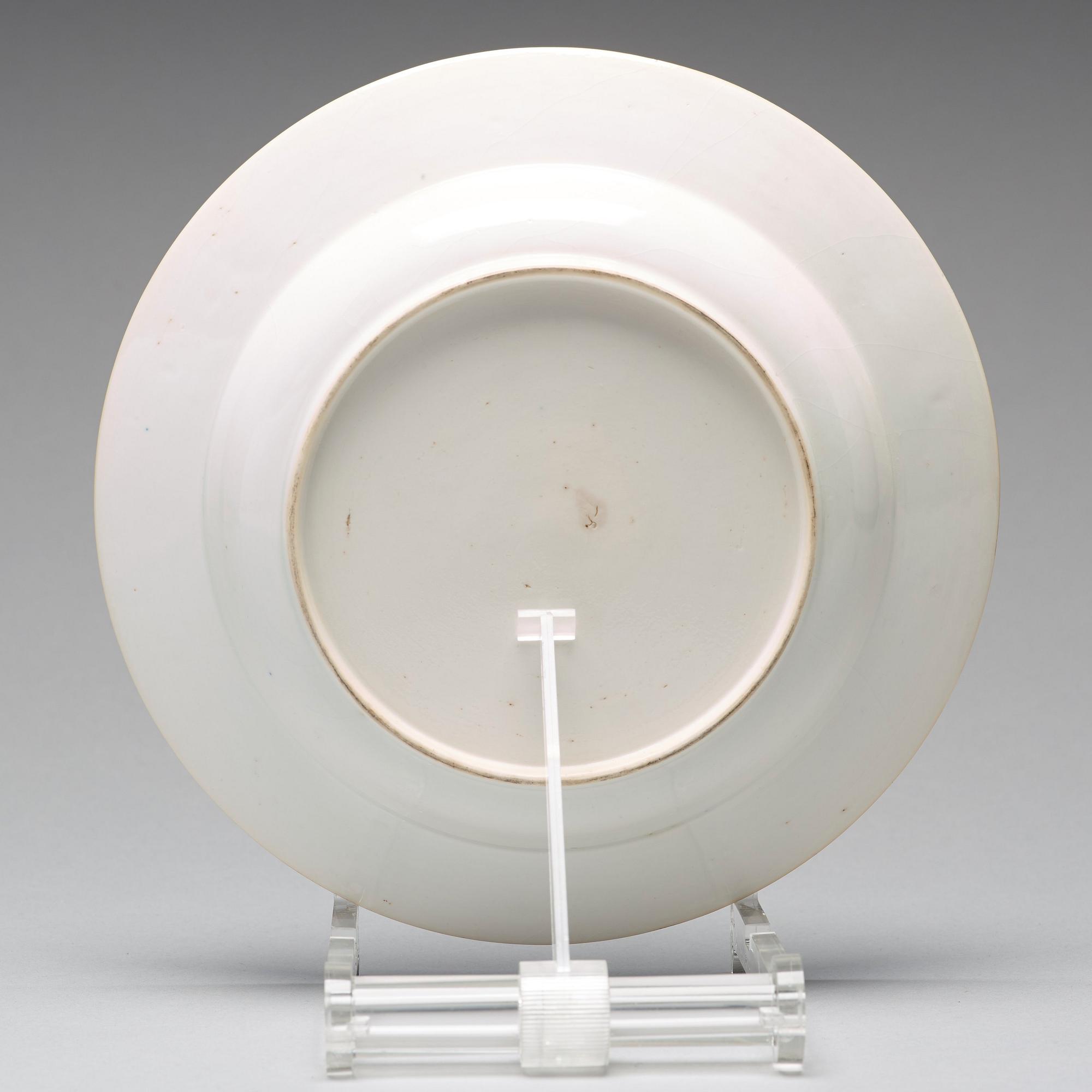 A set of eight blue and white armorial soup dishes, Qing dynasty, 18th Century.