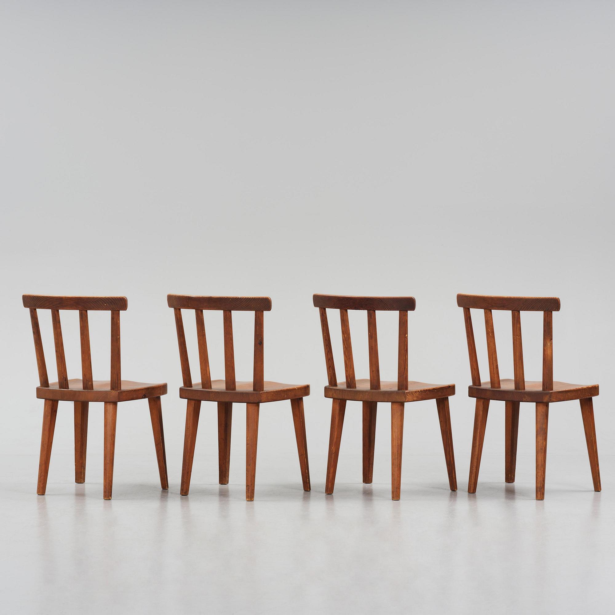 Axel Einar Hjorth, a set of four stained pine "Utö" chairs, Nordiska Kompaniet, Sweden, 1930s.