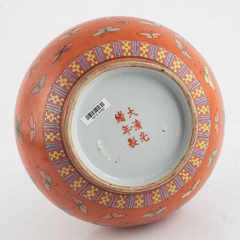 A Chinese coral read ground butterfly vase, 20th century.