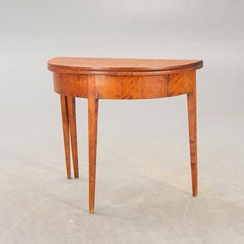 A birch late 19th century game table.