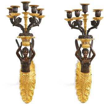 37. A pair of French Empire five-branch gilt and patinated bronze appliques, first part 19th century.