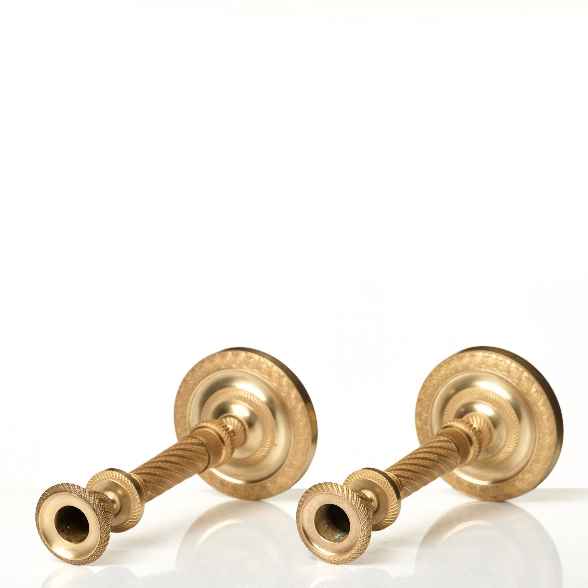 A pair of Empire candlesticks.