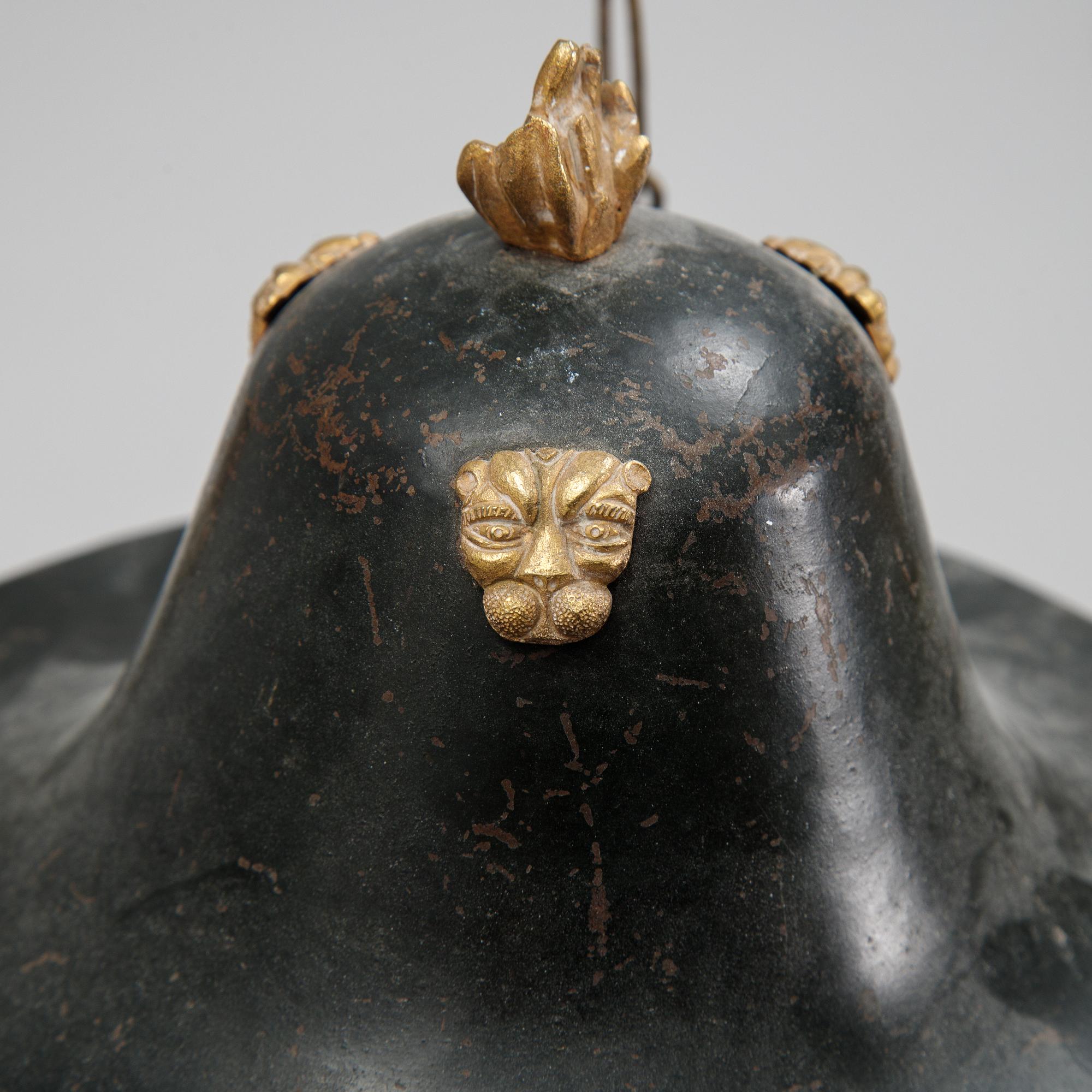 A Swedish Empire style 20th century three-light patinated brass hanging-lamp.