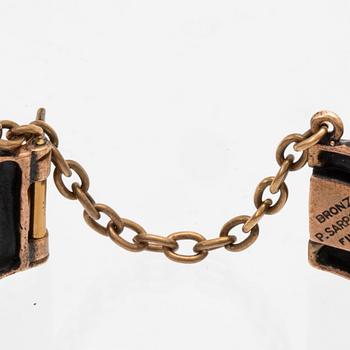 A bronze bracelet set with amethysts by Pentti Sarpaneva.