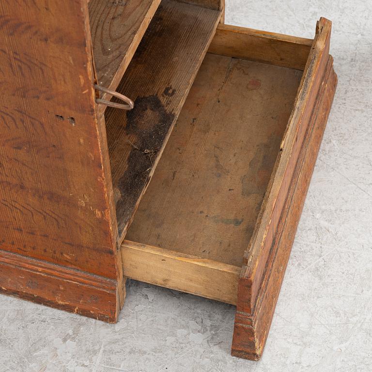 A hanging cabinet, dated 1850.