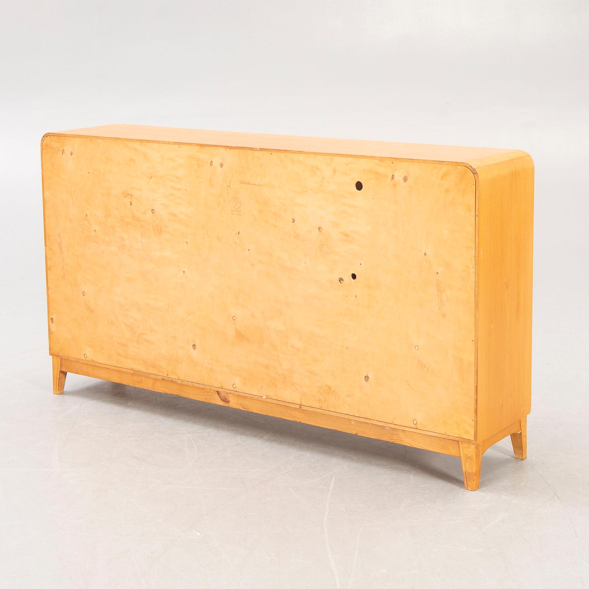 A 1940s birch book shelf.