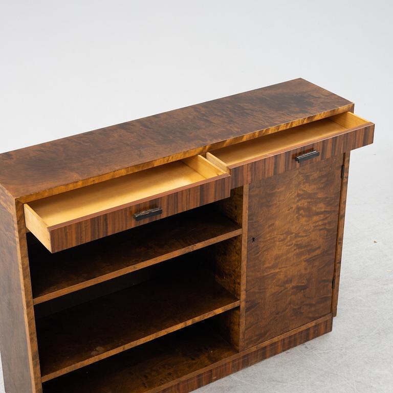 A stained birch veneered bookcase with cabinet, 1930's.