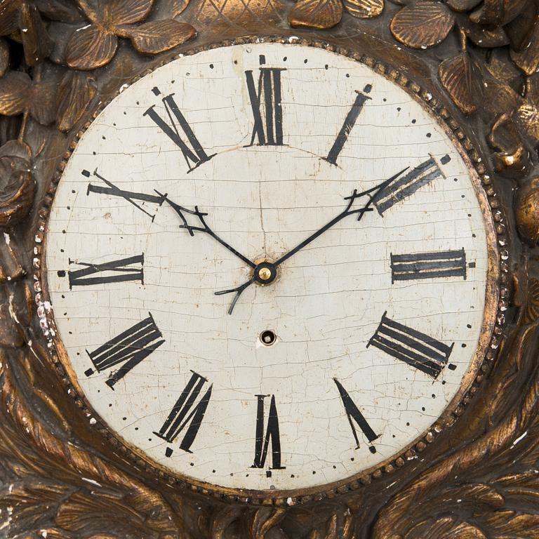A 18th century wall clock.