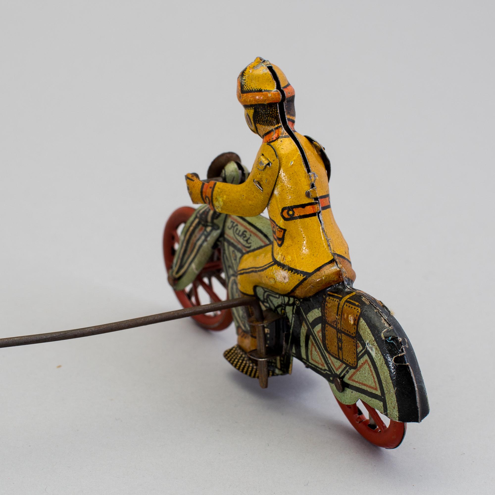 A tinplate Huki roundabout motorcycle, Germany, 1930s.