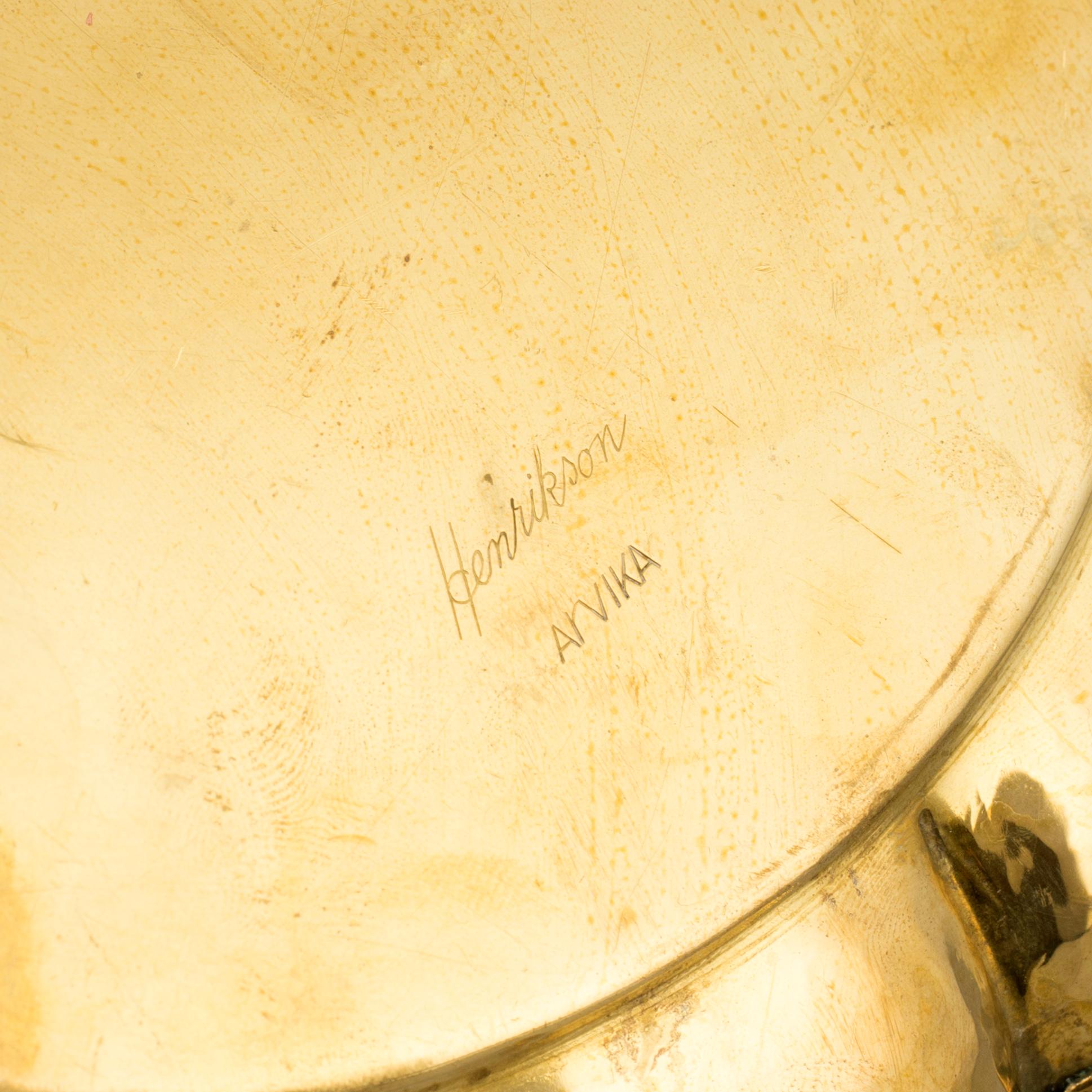 A set of four brass plates by Ture Henrikson, Arvika.