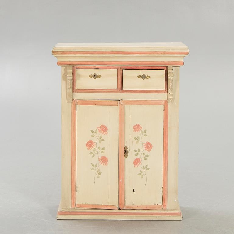 An 18th century painted cabinet.