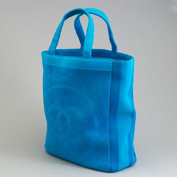 A Jumbo Bright Turquoise Blue "CC" Logo Cotton TERRY Cloth Beach Bag TOTE by Chanel and matching towel.