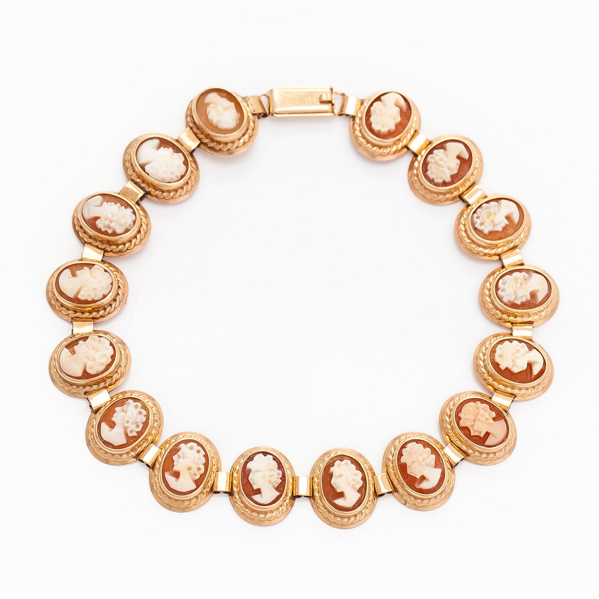 A 14K gold and shell cameo jewelry set, bracelet, pendant/brooch and ring.