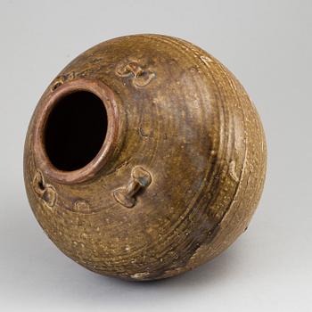 A olive green glazed jar, South East Asia, 18th Century or older.