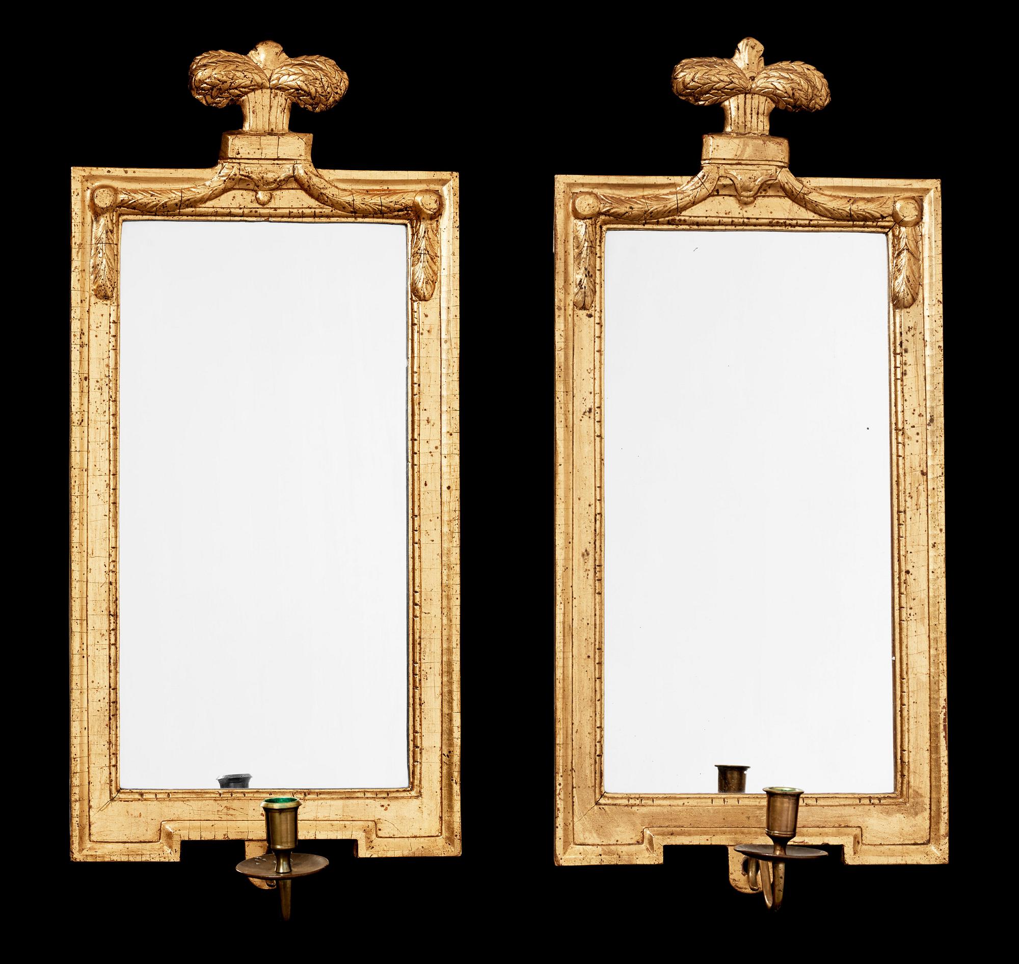 A pair of Gustavian late 18th century one-light girandole mirrors.