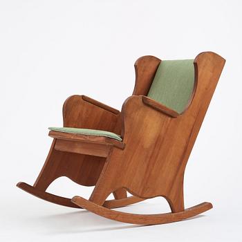 Nordiska Kompaniet, a Swedish Modern stained pine 'Lovö' rocking chair, 1940s.