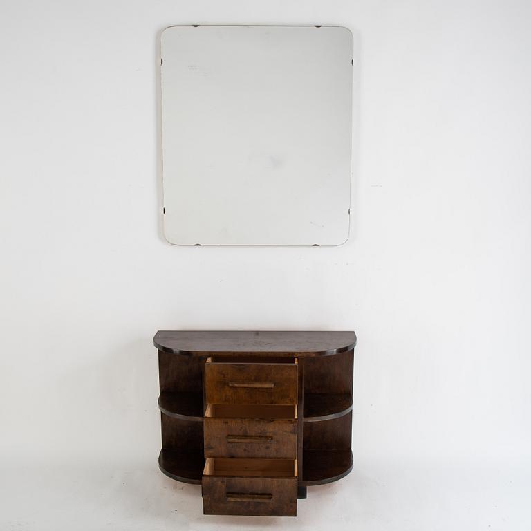 A stained birch chest of drawers and mirror, 1930's.