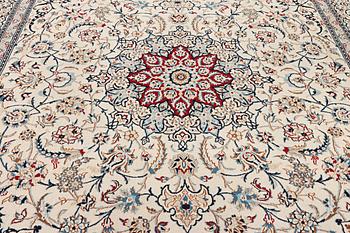 A Nain carpet, part silk, 9 laa, c. 390 x 295 cm.