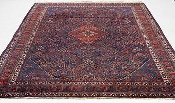 An oriental carpet, c. 360 x 270 cm.